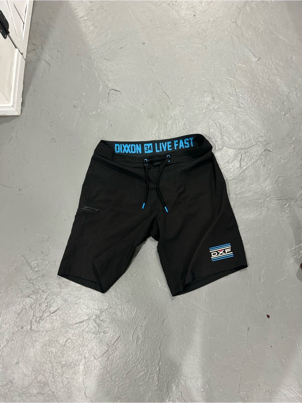 DIXXON Black Board Shorts with Blue Accents